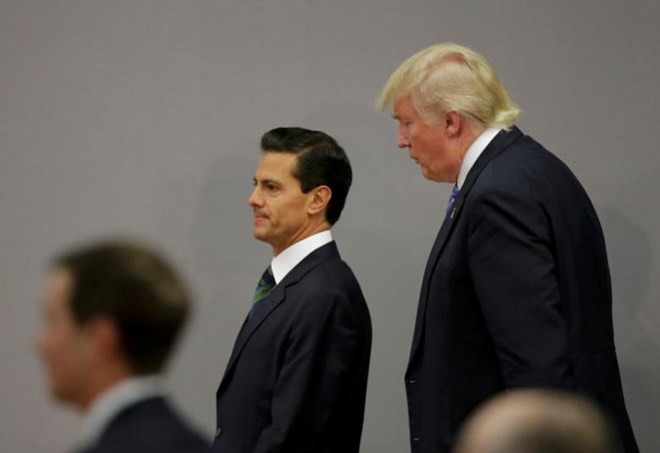 U.S. Republican presidential nominee Donald Trump and Mexico's President Enrique Pena Nieto walk out after finishing a press conference at the Los Pinos residence in Mexico City, Mexico, August 31, 2016. REUTERS/Henry Romero